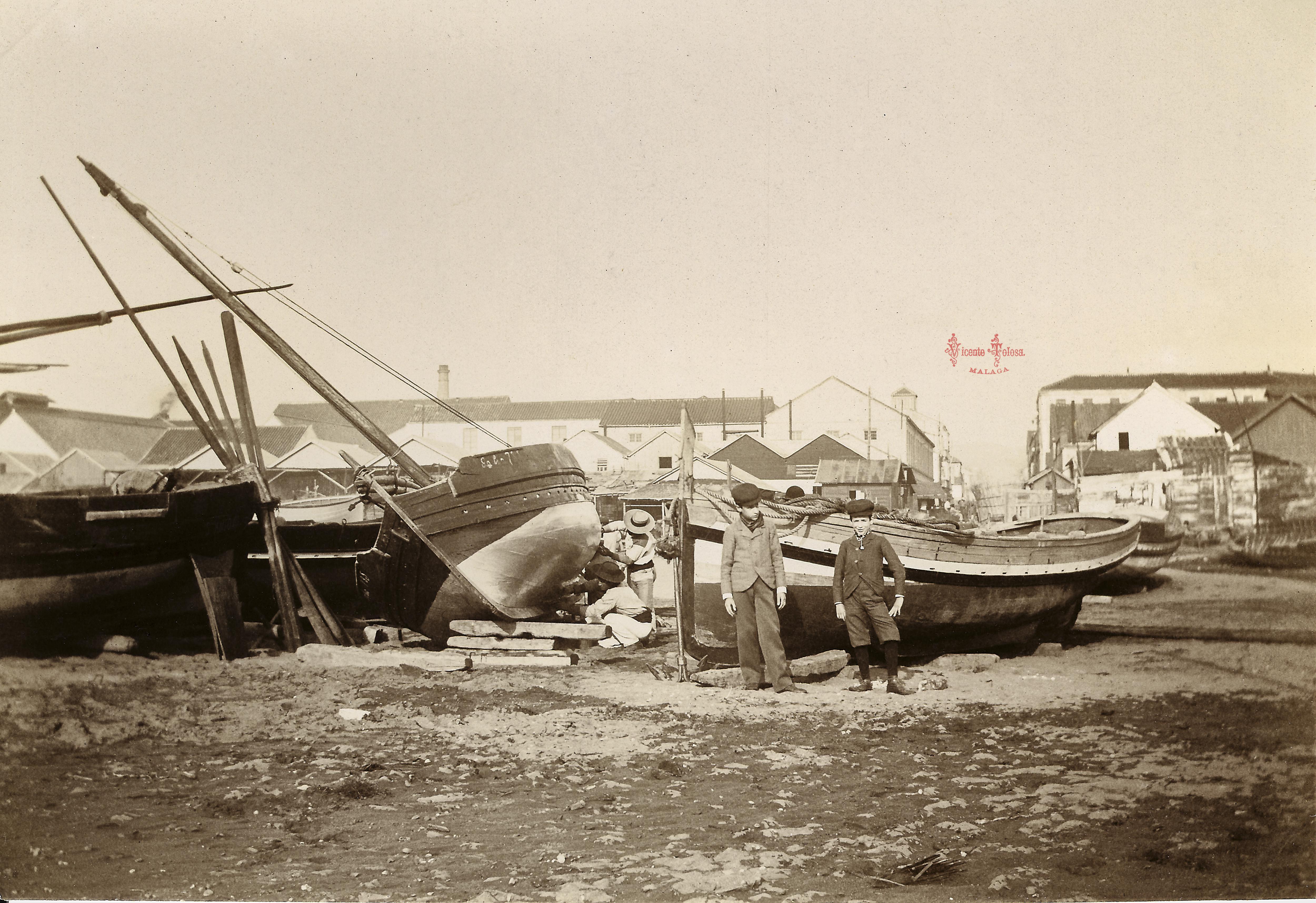 Calafateando (Abuelo Antonio y su hermano Pepe en primer plano). Sobre 1900