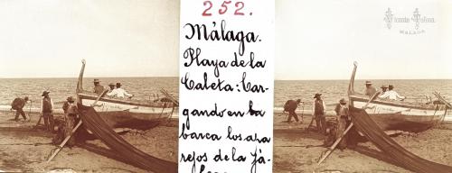 Malaga: Playa de la Caleta: Cargando en la braca los aparejos de la jabega. 1905